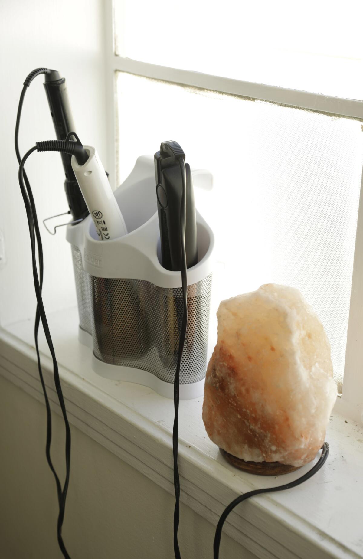 Flat irons and curling wands inside the office of Gloria Calderón Kellett, the co-showrunner of Netflix's reboot of "One Day at a Time," on the Sony lot.