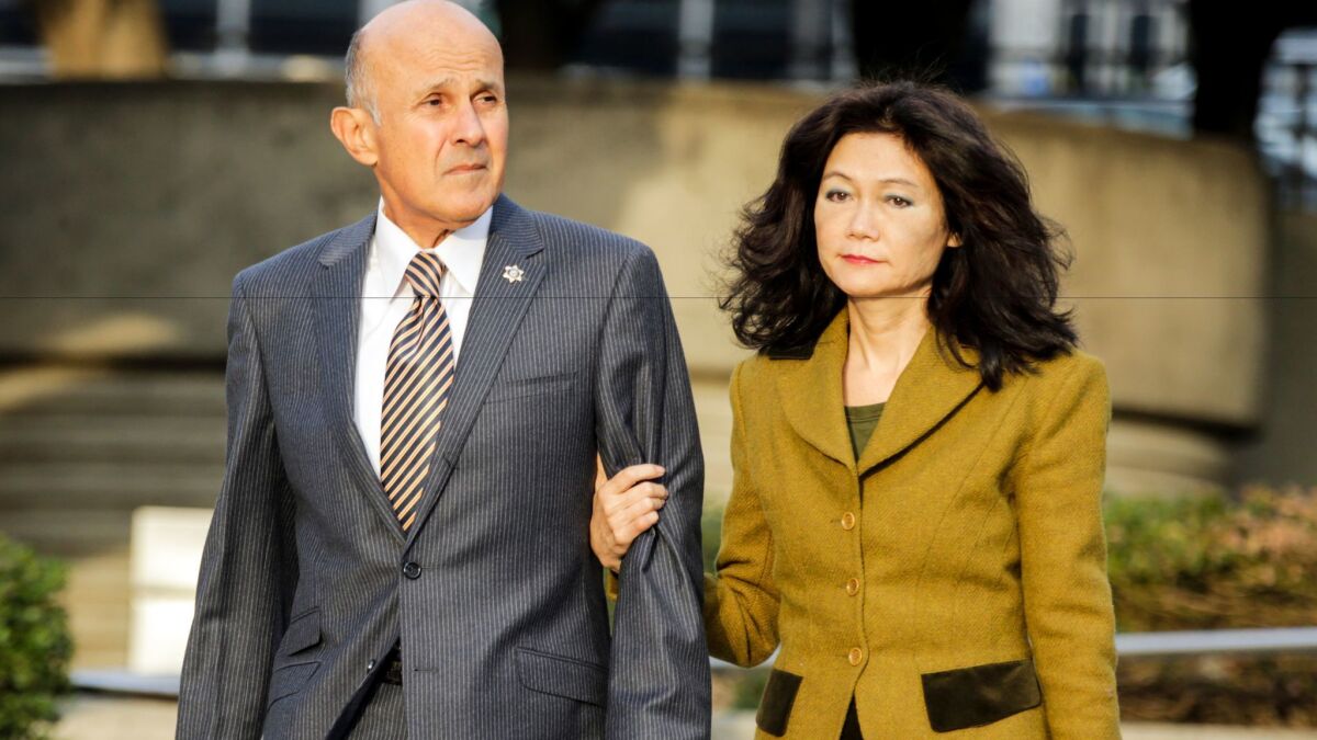 Former Los Angeles County Sheriff Lee Baca and his wife, Carol Chiang, arrive at the federal courthouse in downtown Los Angeles this month for his trial on charges of conspiracy and obstruction of justice.