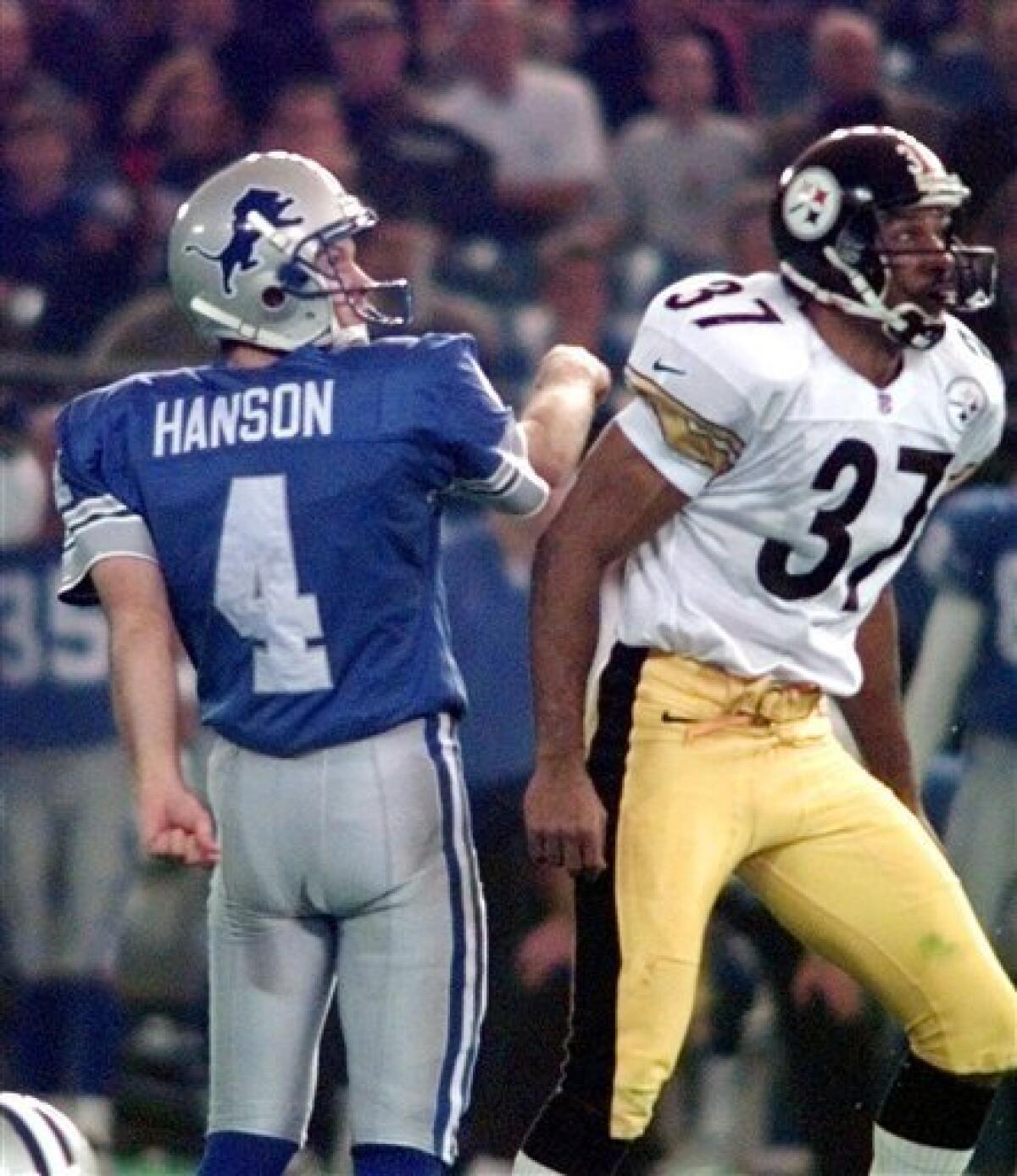 In this Nov. 25, 1993 file photo, The Dallas Cowboys and Miami Dolphins  meet on the icy field of Texas Stadium for an NFL football game on  Thanksgiving Day in Irving, Texas.