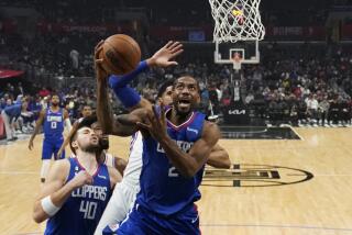 Los Angeles Clippers forward Kawhi Leonard (2) shoots against Philadelphia 76ers forward Tobias Harris during the first half of an NBA basketball game in Los Angeles, Tuesday, Jan. 17, 2023. (AP Photo/Ashley Landis)