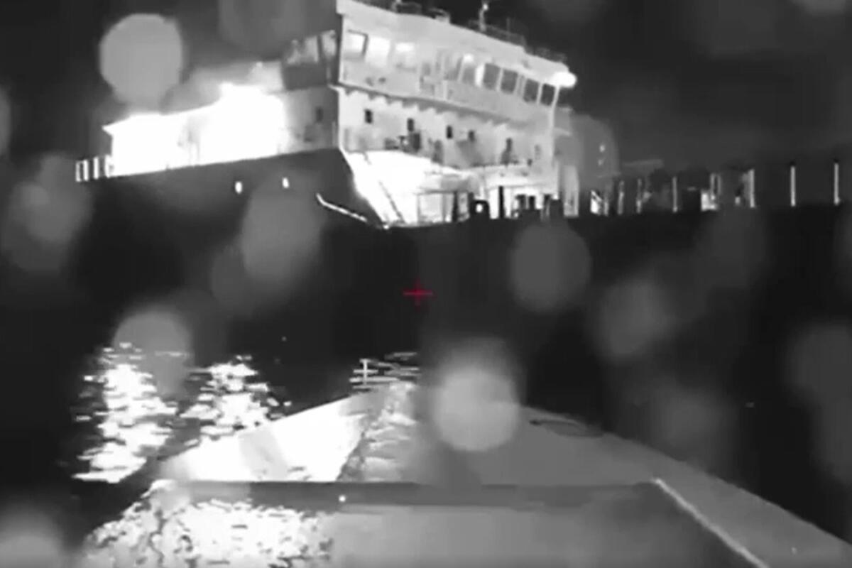 In this image from video, a seaborne drone approaches a Russian tanker 