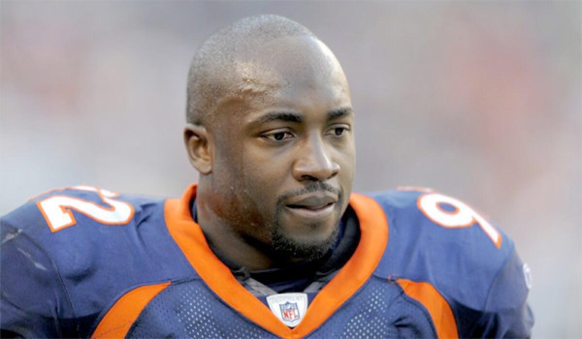Elvis Dumervil was released by the Denver Broncos after the team failed to receive a signed copy of a new contract with the defensive end that included a $4-million pay cut before a deadline.