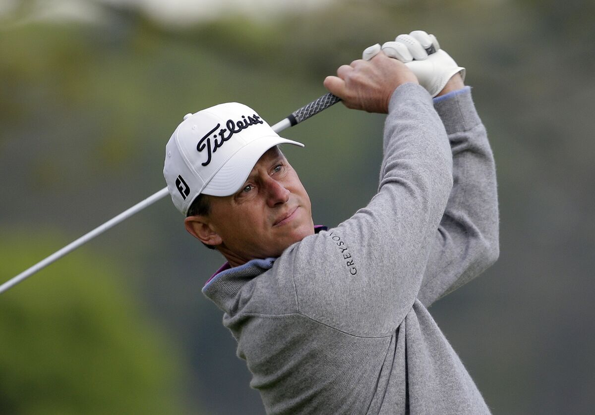 FILE - In this May 16, 2019, file photo, Jason Caron tees off on the second hole during the first round of the PGA Championship golf tournament at Bethpage Black in Farmingdale, N.Y. Caron returns for the PGA this year at Harding Park as business has picked up at the Long Island golf club in New York where he is a head golf professional. (AP Photo/Seth Wenig, File)