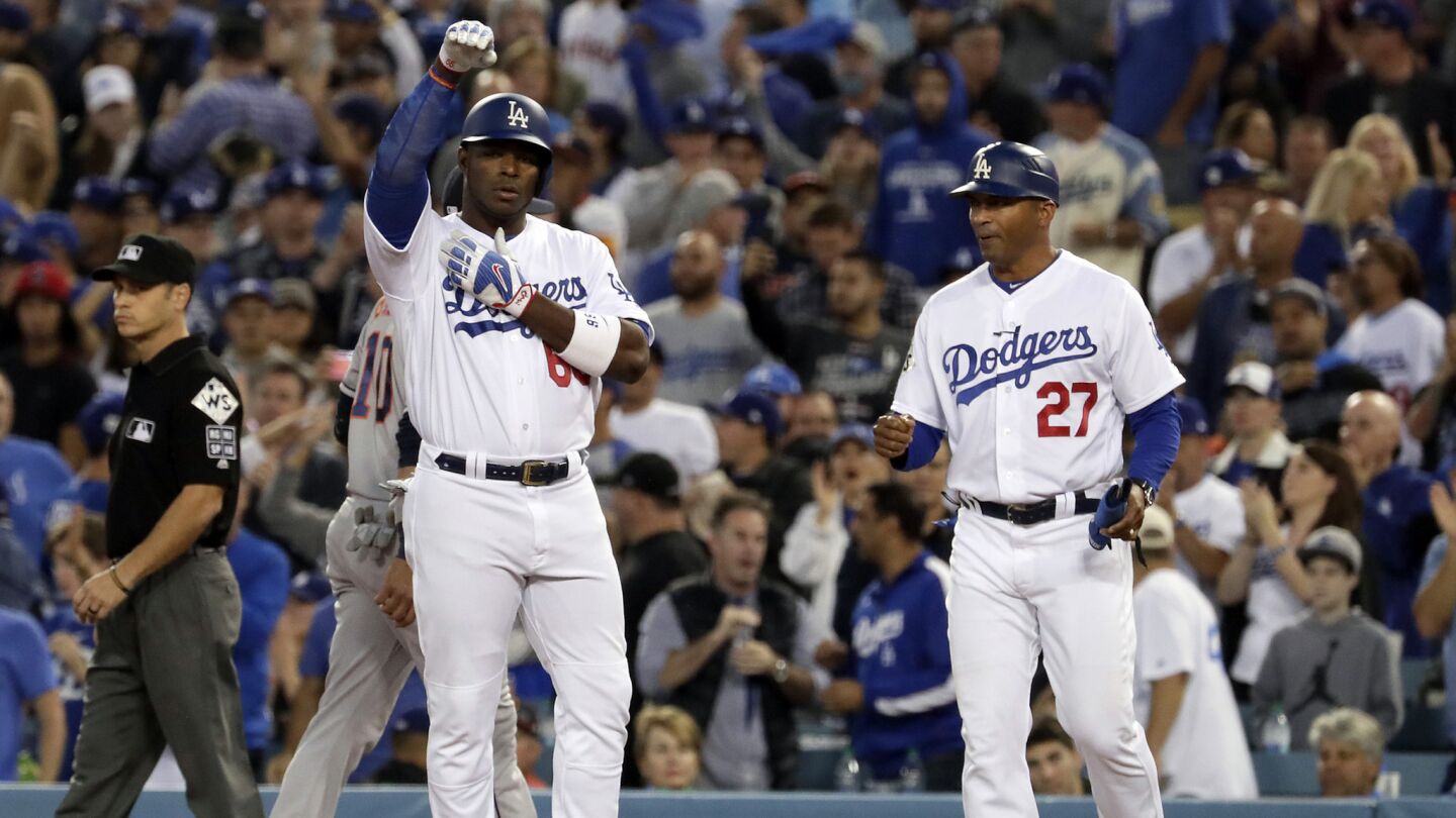 Yasiel Puig reacts after hitting a single in the second inning.