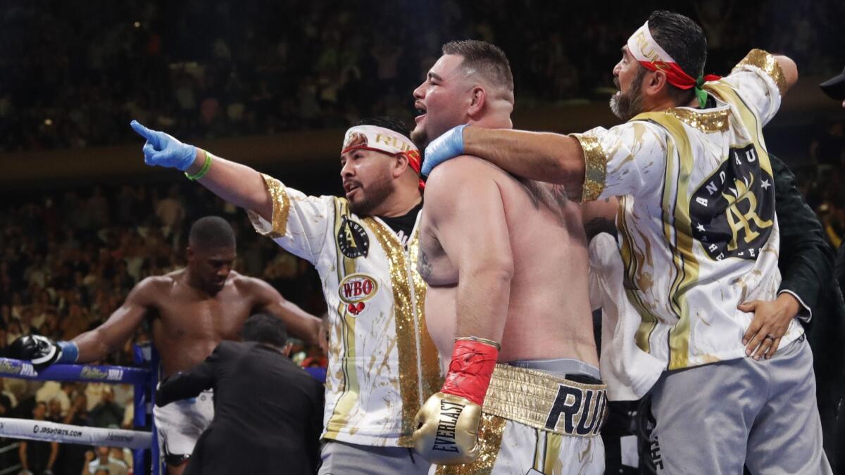 Andy Ruiz Jr. celebrates with trainer Manny Robles, right, and others after his victory over Anthony Joshua.