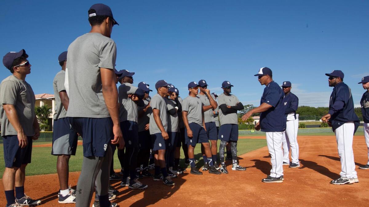 Padres outfield and base-running coordinator Tony Tarasco instructs prospects at the team's Dominican academy on Feb. 2.