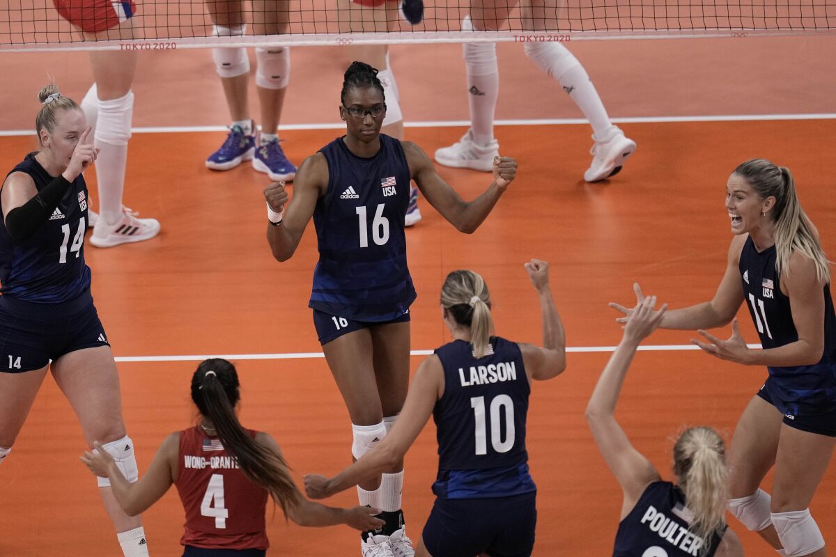 United States players celebrate winning a point during the women's volleyball.