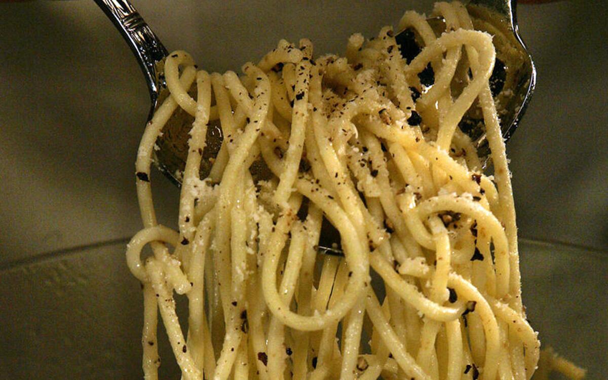 Spaghetti with crushed black pepper and pecorino cheese