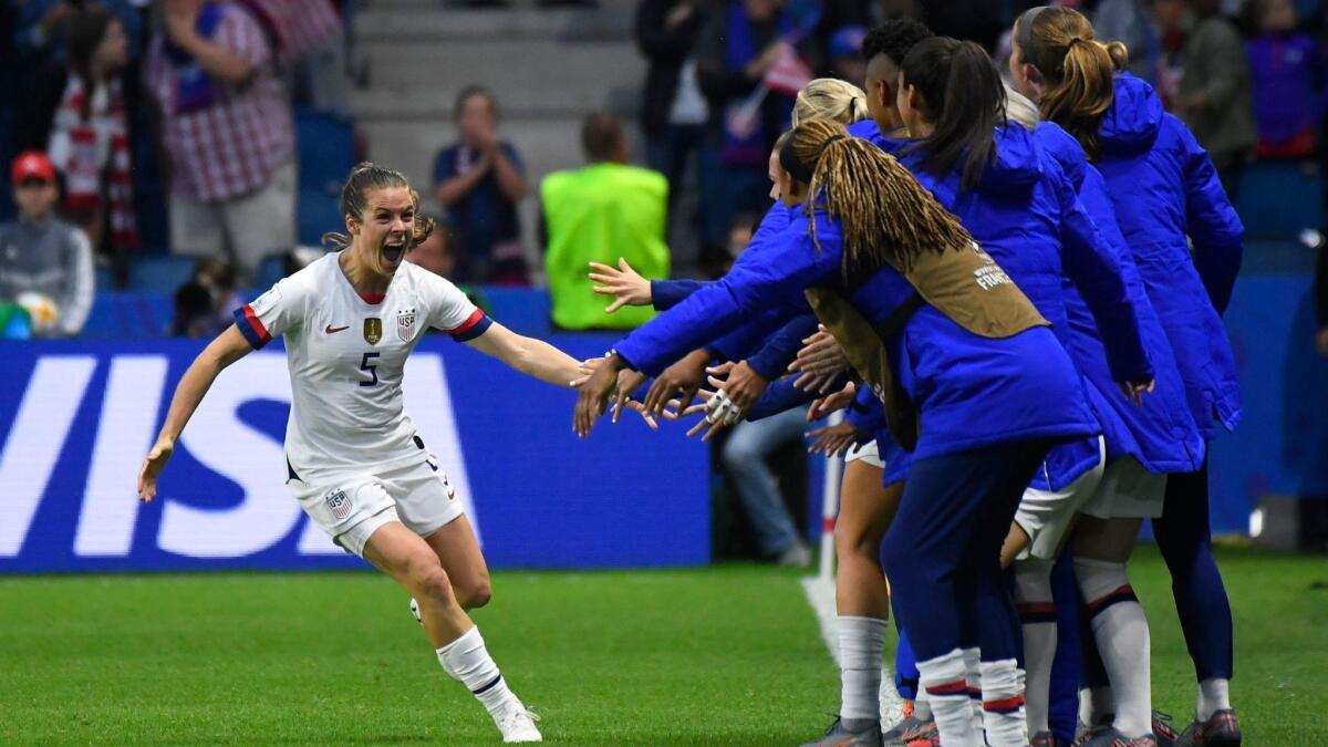 Defender Kelley O'Hara celebrates with teammates after the United States' second goal during a 2-0 victory over Sweden at the Women's World Cup on Thursday.