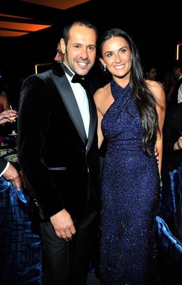 Salvatore Ferragamo Group's creative director, Massimiliano Giornetti, and actress Demi Moore, wearing Ferragamo, attend the inaugural gala for the Wallis Annenberg Center for the Performing Arts in Beverly Hills.