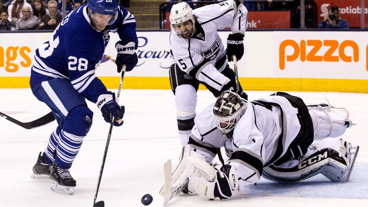 Kings goaltender Jhonas Enroth makes a save against Toronto's Brad Boyes (28) in the second period Sunday.