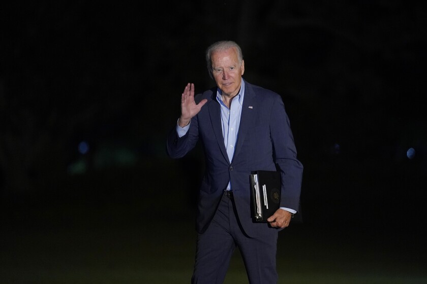 President Joe Biden waves as he walks from Marine One across the South Lawn of the White House in Washington, late Sunday, July 11, 2021, after returning from a weekend in Delaware. (AP Photo/Susan Walsh)
