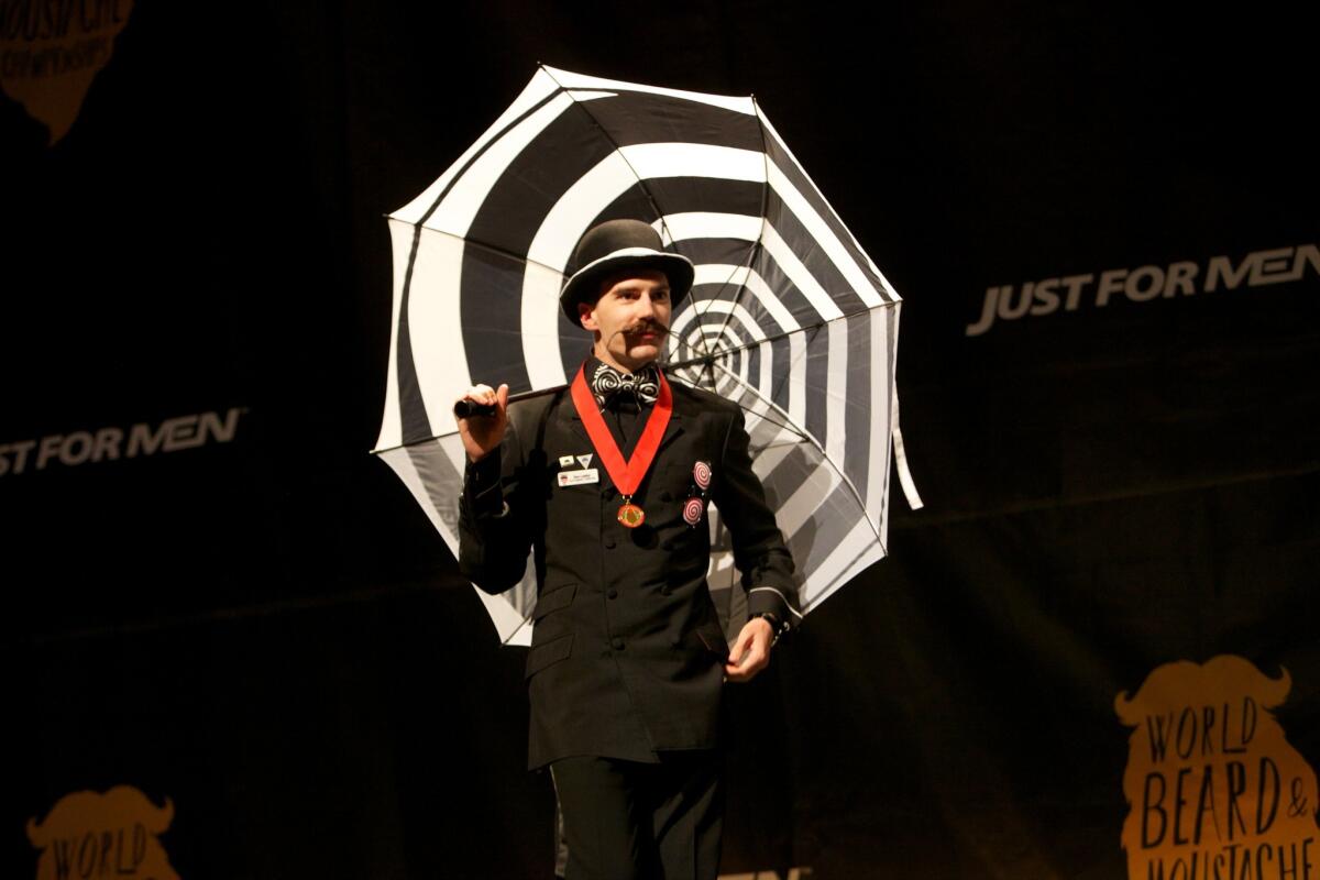Dan Lawlor hits the stage in Portland, Ore., during the Just for Men World Beard and Moustache Championships on Oct. 25.