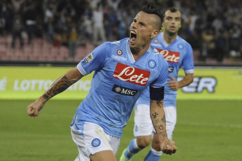 FILE - Napoli's Marek Hamsik, of Slovakia, celebrates after scoring during a Serie A soccer match between Napoli and Udinese, at the Napoli San Paolo stadium, Italy, Sunday, Oct. 7, 2012. Former Slovakia and Napoli captain Marek Hamšík announced on Thursday, June 1, 2023, he is retiring from soccer at the end of the season. (AP Photo/Salvatore Laporta, File)