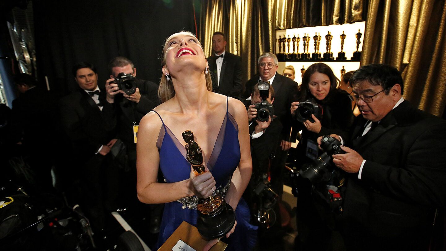 Brie Larson is ecstatic as she walks off the stage with the lead actress Oscar for her role in "Room."
