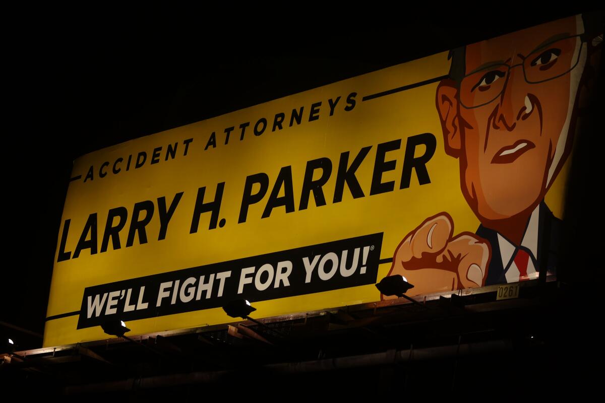 A billboard for the real business Larry H. Parker Accident Attorneys in South Los Angeles.