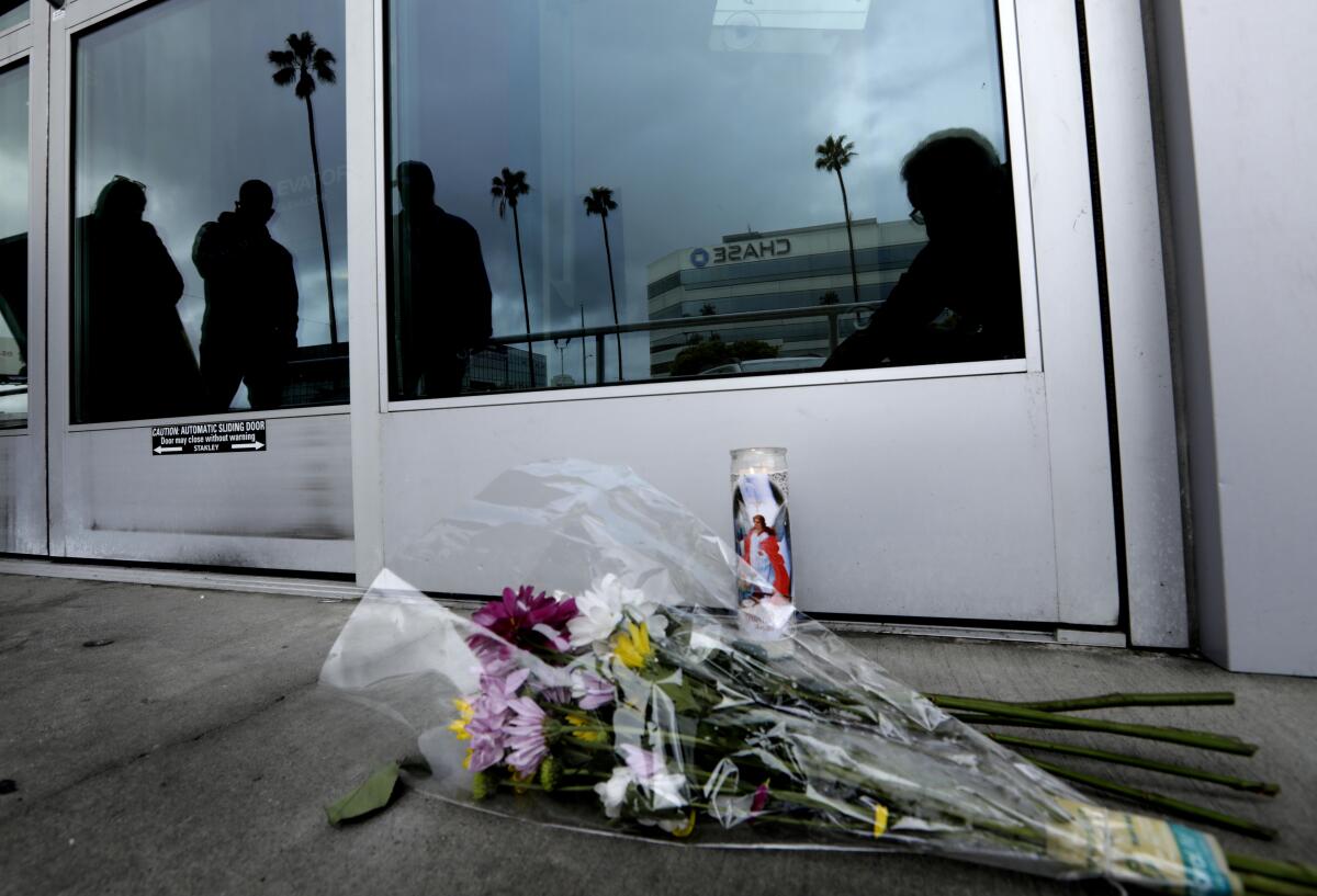 Flowers were left in memory of Valentina Orellana-Peralta , 14, who was a shooting victim at the Burlington clothing store.