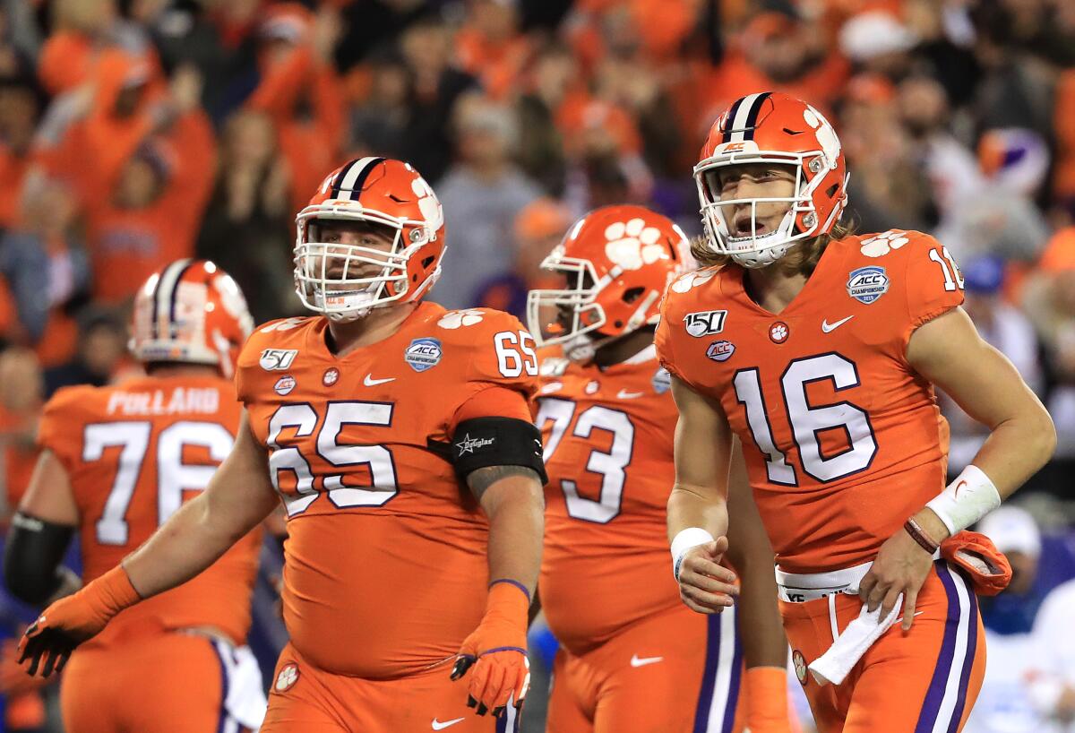 Clemson quarterback Trevor Lawrence (16) celebrates after a touchdown against Virginia on Dec. 7 in the ACC championship game.