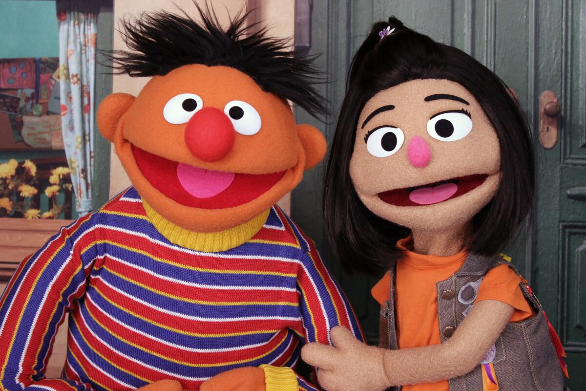 Muppets Ernie and Ji-Young on "Sesame Street."