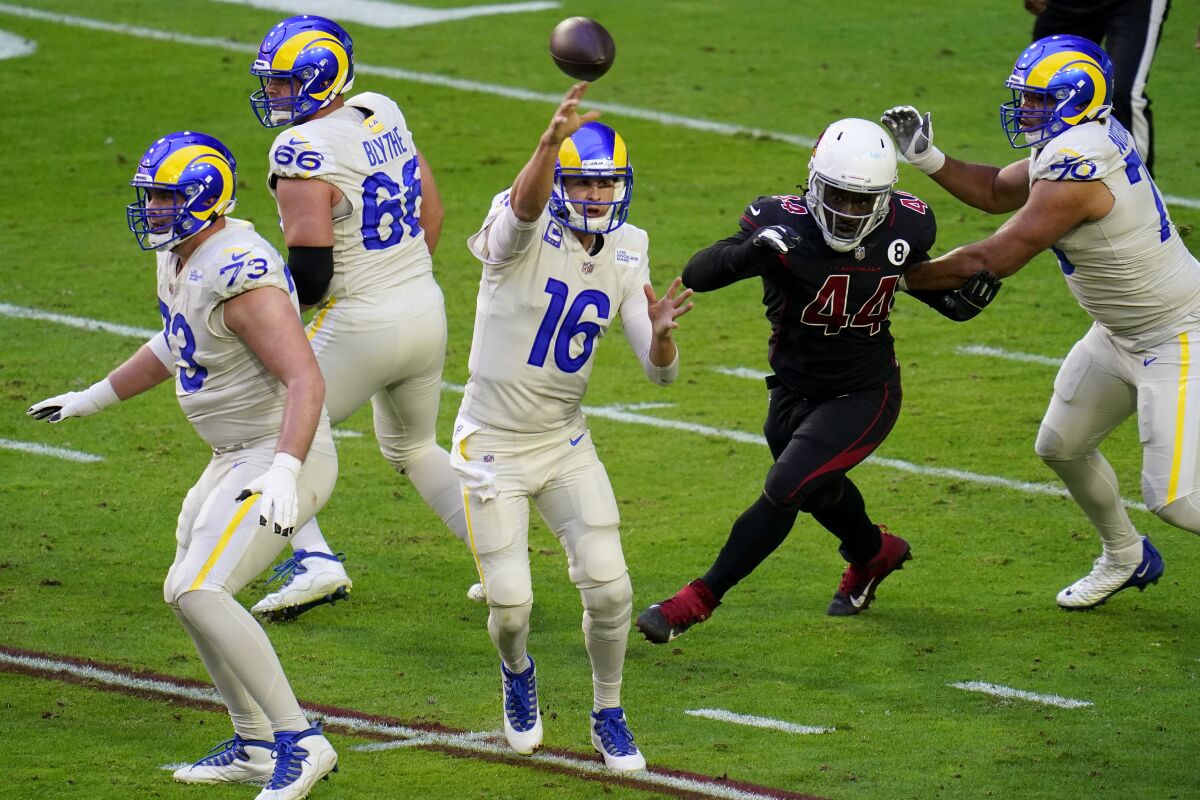 Rams quarterback Jared Goff throws in front of Arizona Cardinals linebacker Markus Golden.