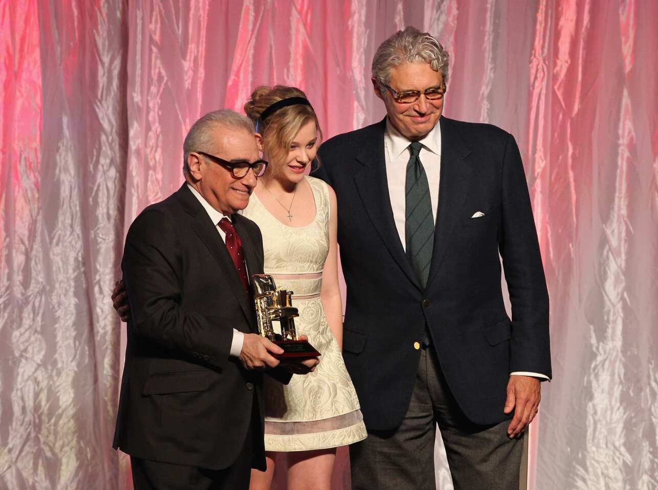 Filmmaker Martin Scorsese, actress Chloe Moretz and host Michael Nouri speak onstage. The "Hugo" director also was on hand to present Sharon Stone with her lifetime achievement award.