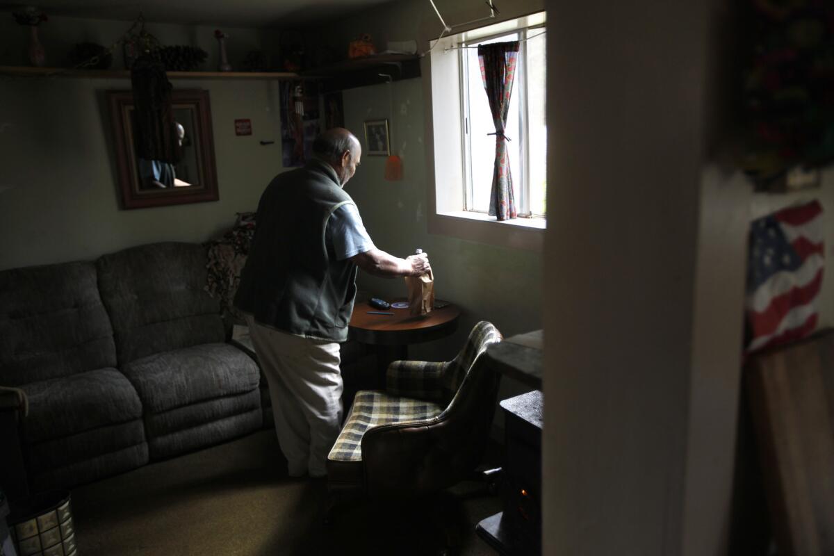 Ed Barrera, 70, heats his home using a wood-burning stove in the foothills of the Sierras.