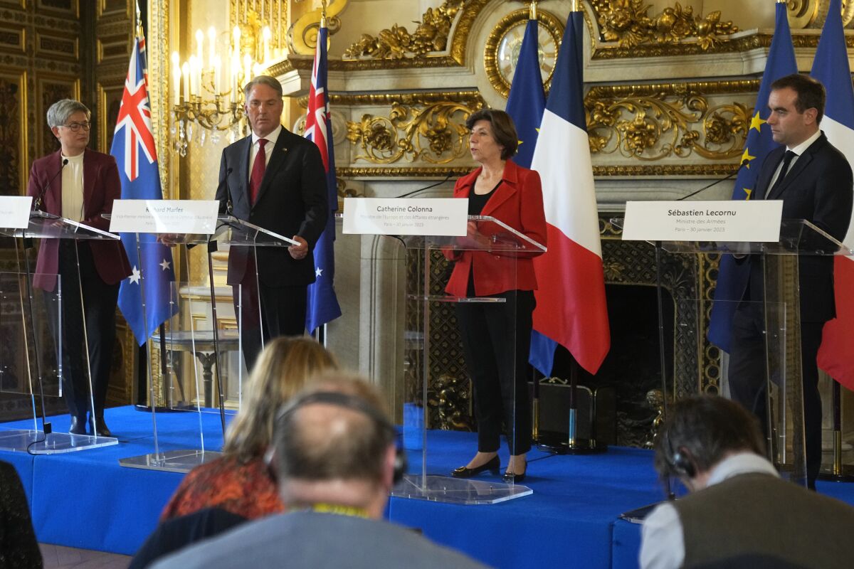 French Foreign Minister Catherine Colonna, second right, French Defense Minister Sebastien Lecornu, right, attend a joint press conference with Australian Defense Minister Richard Marles, second left, and Australian Foreign Minister Penny Wong, Monday, Jan. 30, 2023 in Paris. (AP Photo/Michel Euler)