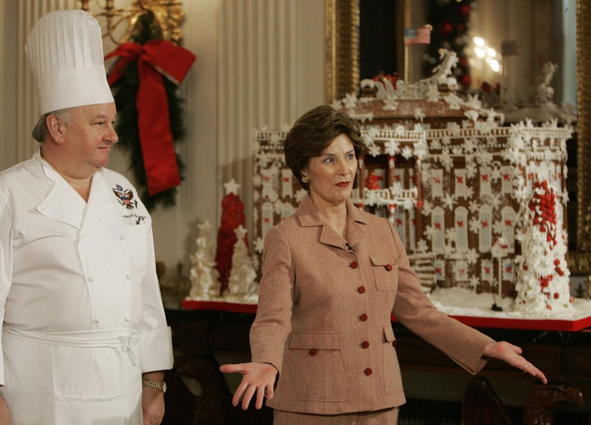 First Lady Laura Bush with chef Roland Mesnier, in 2006.  