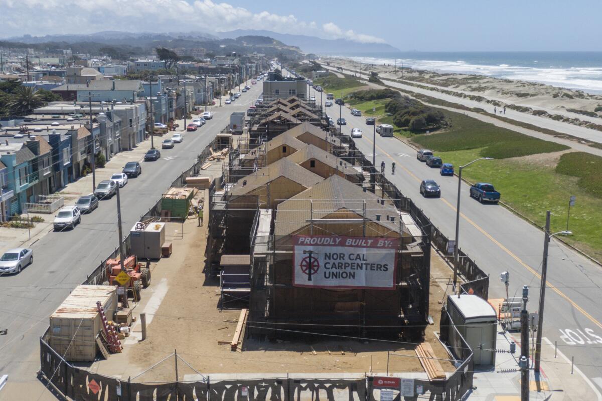 overhead shot of buildings near the ocean