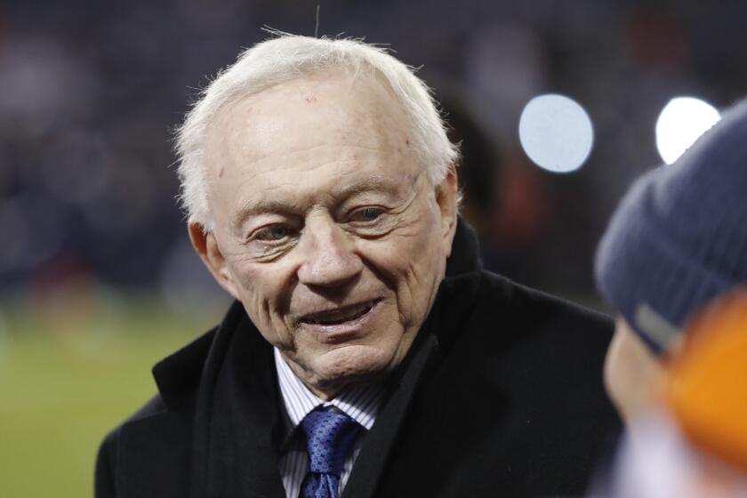 Dallas Cowboys' owner Jerry Jones talks to fans before an NFL football game between the Chicago Bears and the Dallas Cowboys, Thursday, Dec. 5, 2019, in Chicago. (AP Photo/Charles Rex Arbogast)