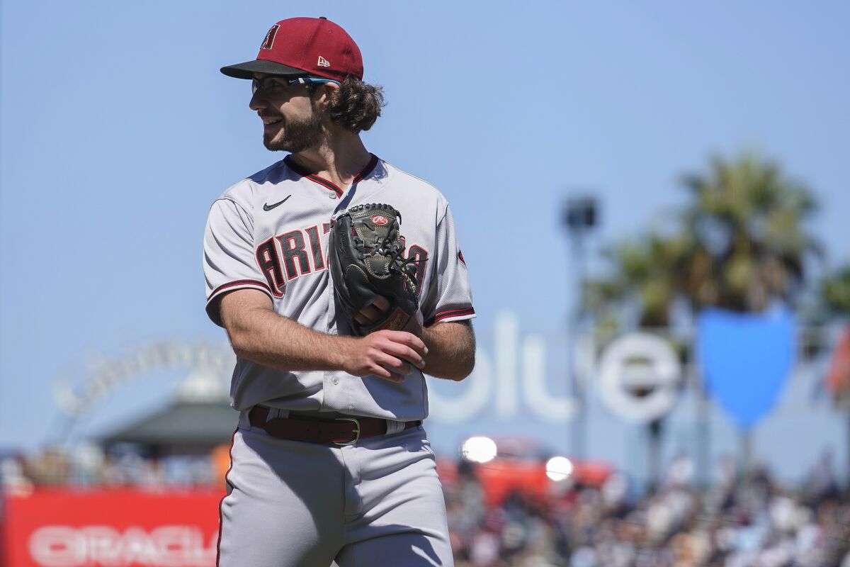Arizona Diamondbacks' Zac Gallen walks to the dugout after pitching against the San Francisco Giants during the seventh inning of a baseball game in San Francisco, Thursday, Aug. 18, 2022. (AP Photo/Godofredo A. Vásquez)