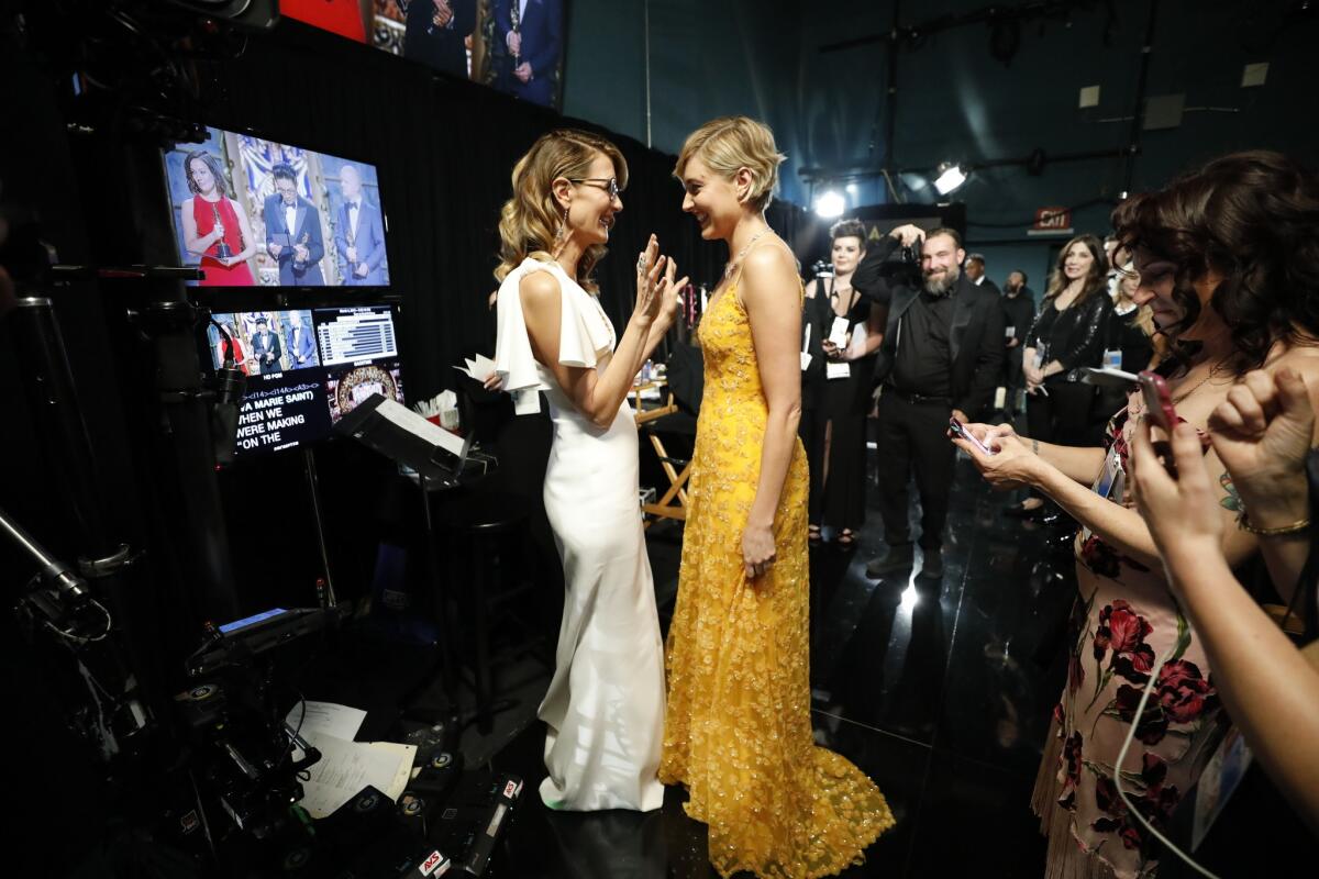 Presenter and Oscar nominee Greta Gerwig, right, with fellow presenter Laura Dern backstage at the 90th Academy Awards.