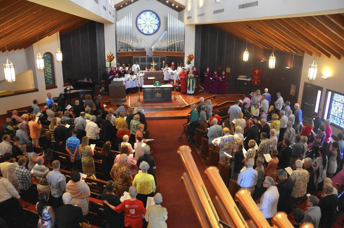The congregation at St. James the Great Episcopal Church gathers for service in late June at its Newport Beach location.