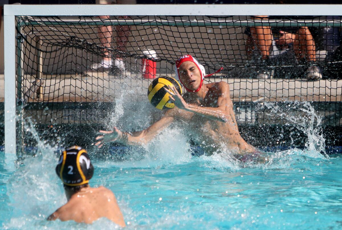 Burroughs High School water polo goalie David Karagezyan stops a 5-meter shot by Jason Alietti in CIF Southern Section Division V quarterfinal match vs. St. Francis High School at Notre Dame High School in Sherman Oaks on Saturday, Nov, 9, 2019. St. Francis won the match 9-8.