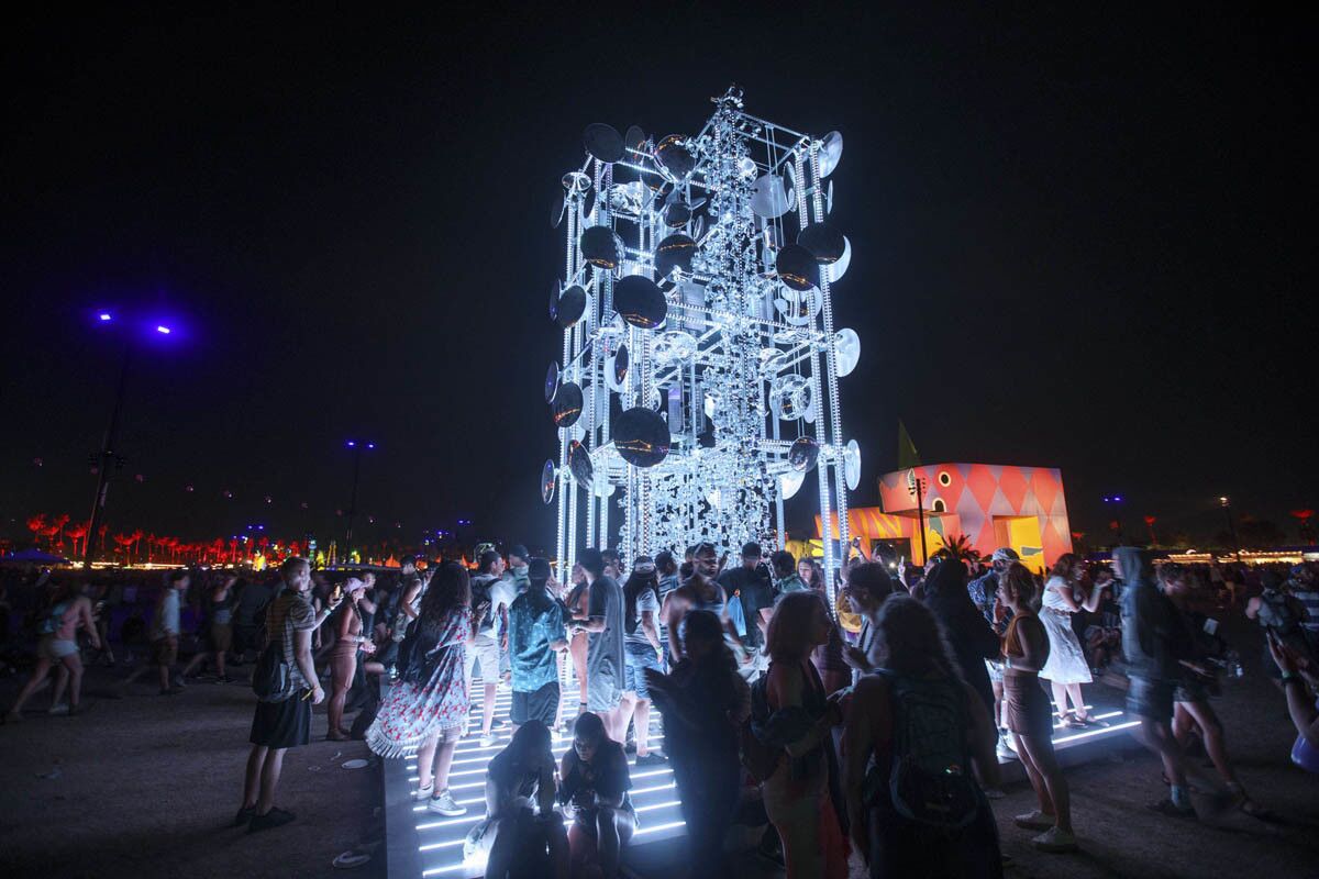 The art installation "Lamp Besides the Golden Door" stands at night during weekend one of the three-day Coachella Valley Music and Arts Festival at the Empire Polo Grounds on Sunday, April 16, 2017 in Indio, Calif. (Patrick T. Fallon/ For The Los Angeles Times)