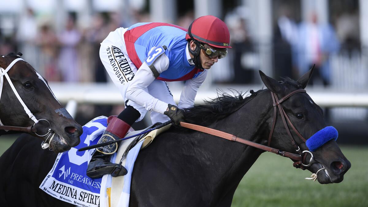 John Velazquez rides Medina Spirit in the Preakness Stakes on May 15, 2021.