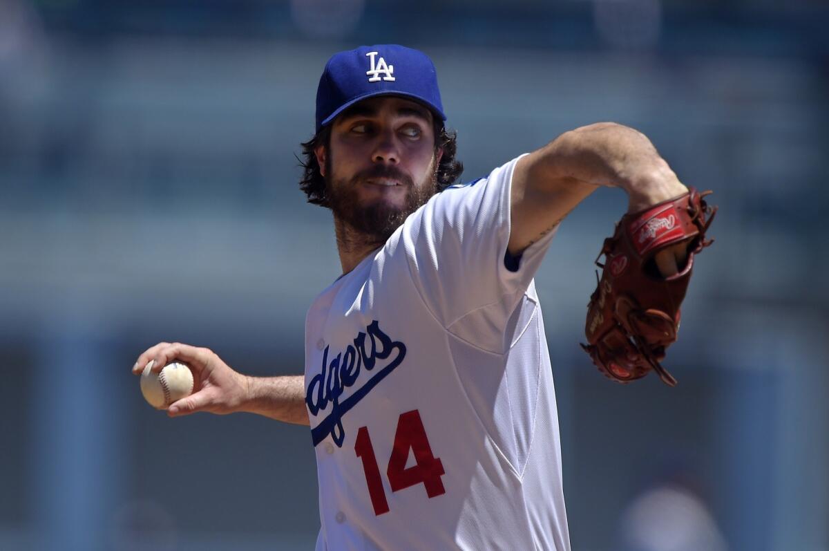 Dan Haren throws to the plate during an Aug. 17 game against the Milwaukee Brewers at Dodger Stadium.