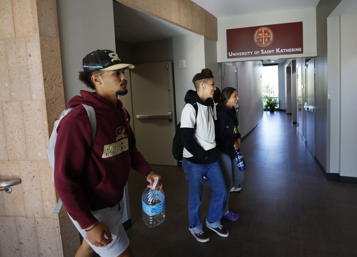 Students walk through the halls during a passing period at The University of Saint Katherine 