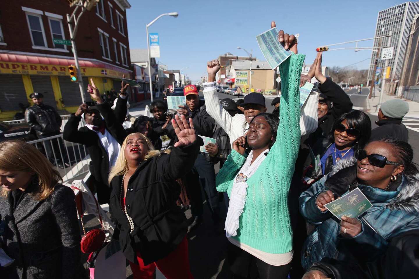 Fans show their emotions during the funeral for Whitney Houston.