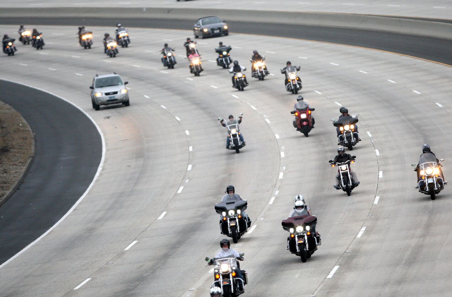 A group of motorcyclists head north on the Glendale Freeway towards the Foothill Freeway during the 32nd annual Love Ride after starting at Harley-Davidson Motorcycles in Glendale on Sunday, October 18, 2015. This will be the last fundraising Love Ride.