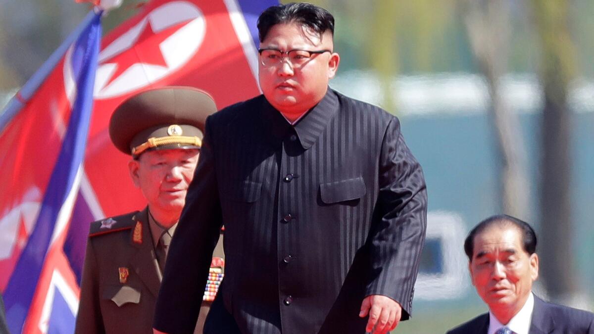 North Korean leader Kim Jong Un, center, arrives for the official opening of the Ryomyong residential area in Pyongyang, North Korea, on April 13, 2017.