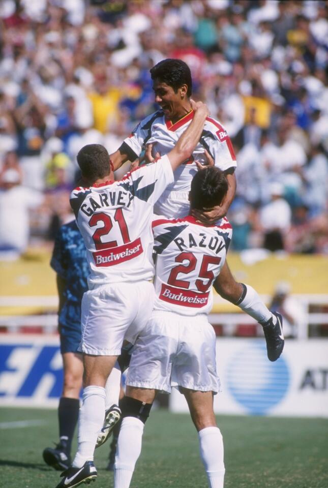 22 Sep 1996: Forward Jorge Campos of the Los Angeles Galaxy is hoisted up by teammates Ante Razov #25 and John Garvey #21 as they celebrate a goal in the Galaxy's 2-1 Major League Soccer MLS victory over the Dallas Burn at the Rose Bowl in Pasadena, Cali