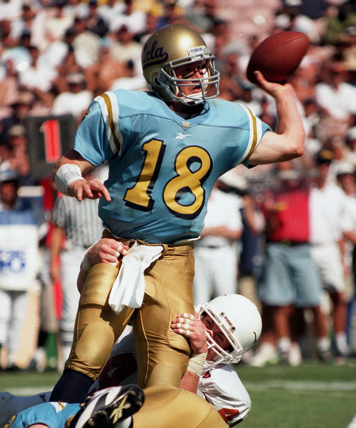 UCLA's Cade NcNown throws a pass against Texas in September 1998.