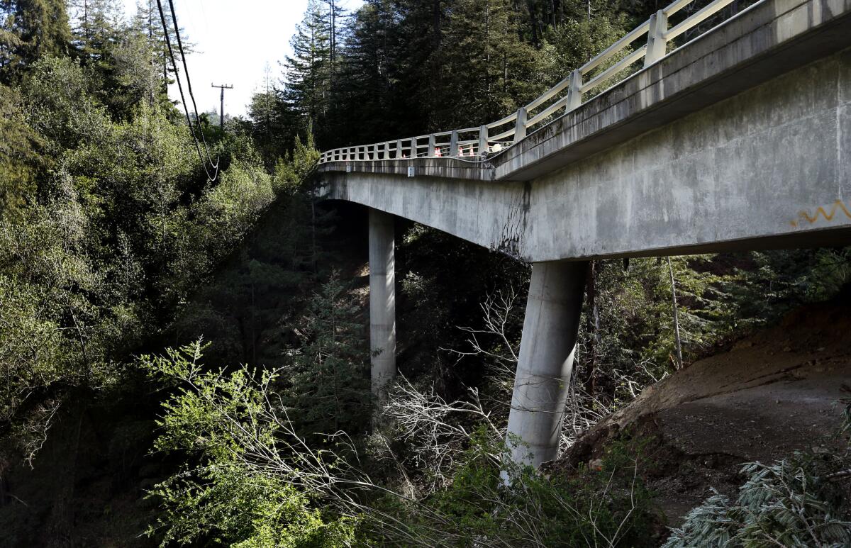 A landslide in Big Sur damaged the Pfeiffer Canyon Bridge, which was condemned and demolished. Caltrans hopes to have a new bridge in place by October. (Mel Melcon / Los Angeles Times)