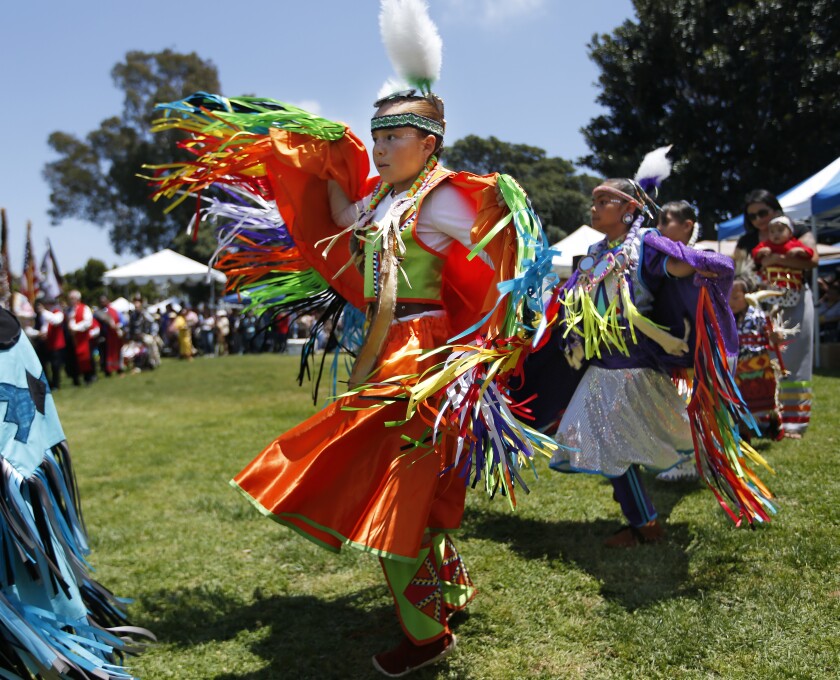 Aislynn Arnold, 10, of Ramona dances during the Grand Entry at the 31st Annual Balboa Park Pow Wow at Balboa Park in San Diego on Sunday.