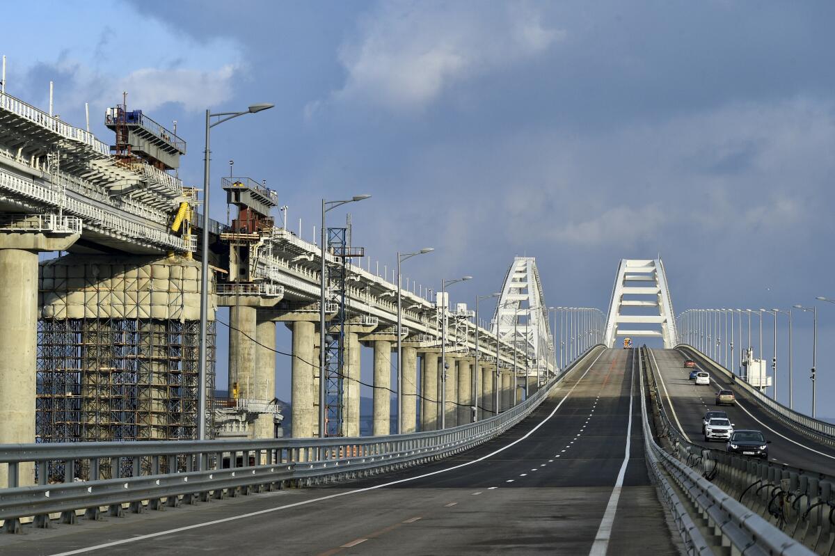 Vehicles drive on the Crimean Bridge connecting Russia and Crimean peninsula after restoration. 