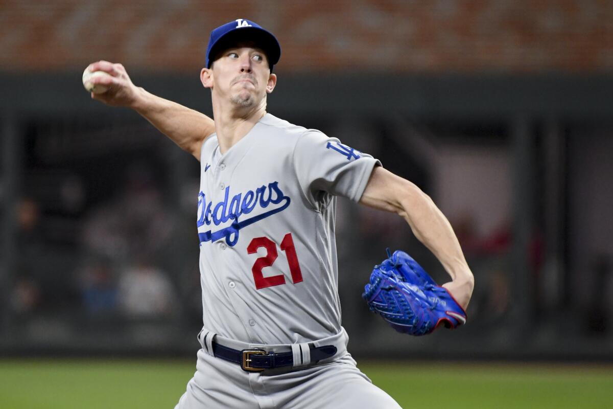 Dodgers pitcher Walker Buehler works against the Atlanta Braves in the 2021 playoffs.