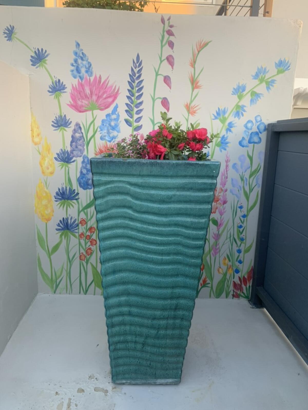 Diane Lehman painted this floral mural for fellow Point Loma resident Jill Johnson.