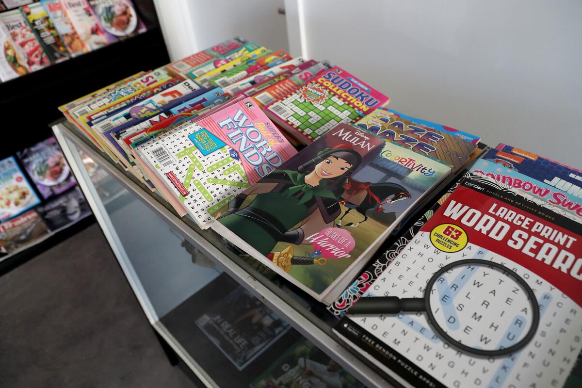 Children's coloring books and word search puzzles for sale at the World Newsstand in Laguna Beach.