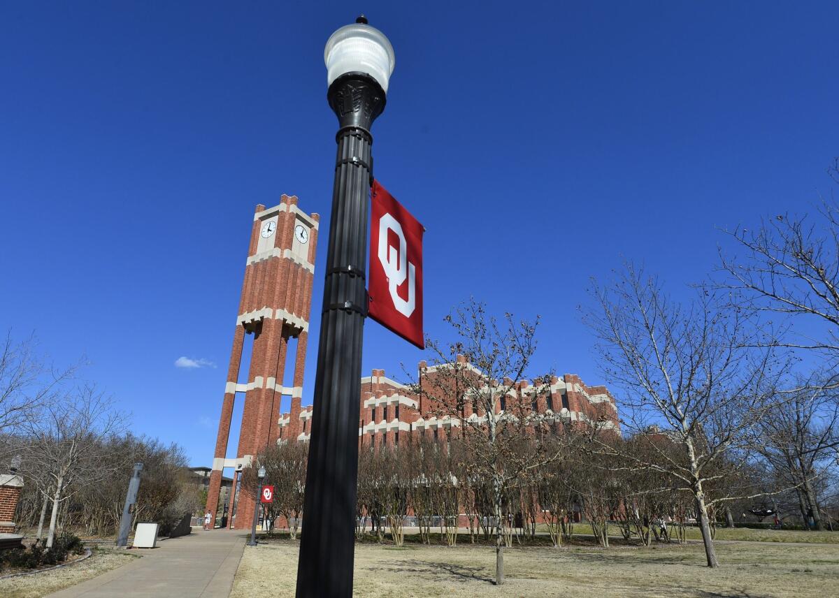 The clock tower of Oklahoma University, which is located a block away from the now-closed and abandoned Sigma Alpha Epsilon fraternity house on campus.